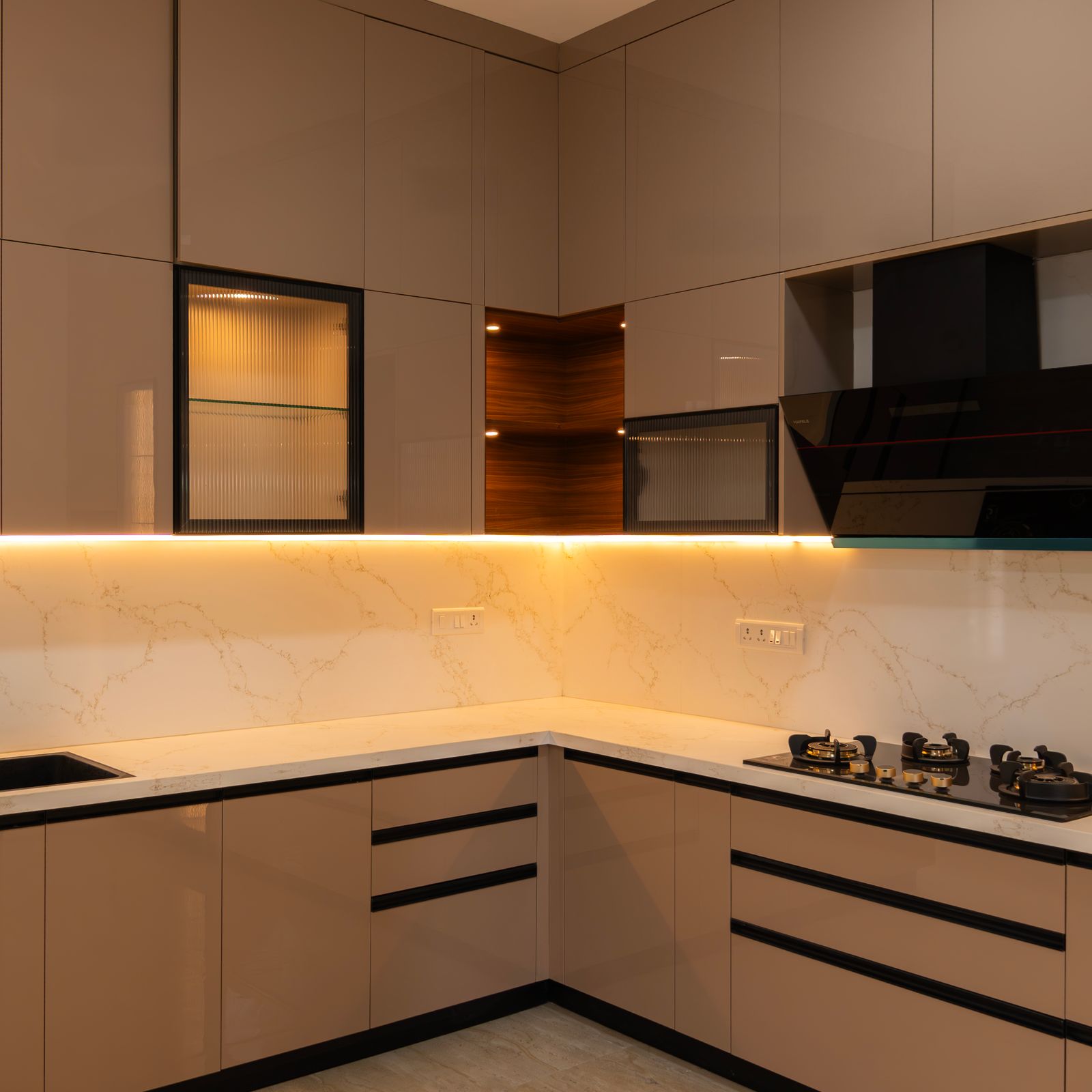 L-Shaped Kitchen Design with Glossy Beige Cabinets and Under Cabinet Lighting