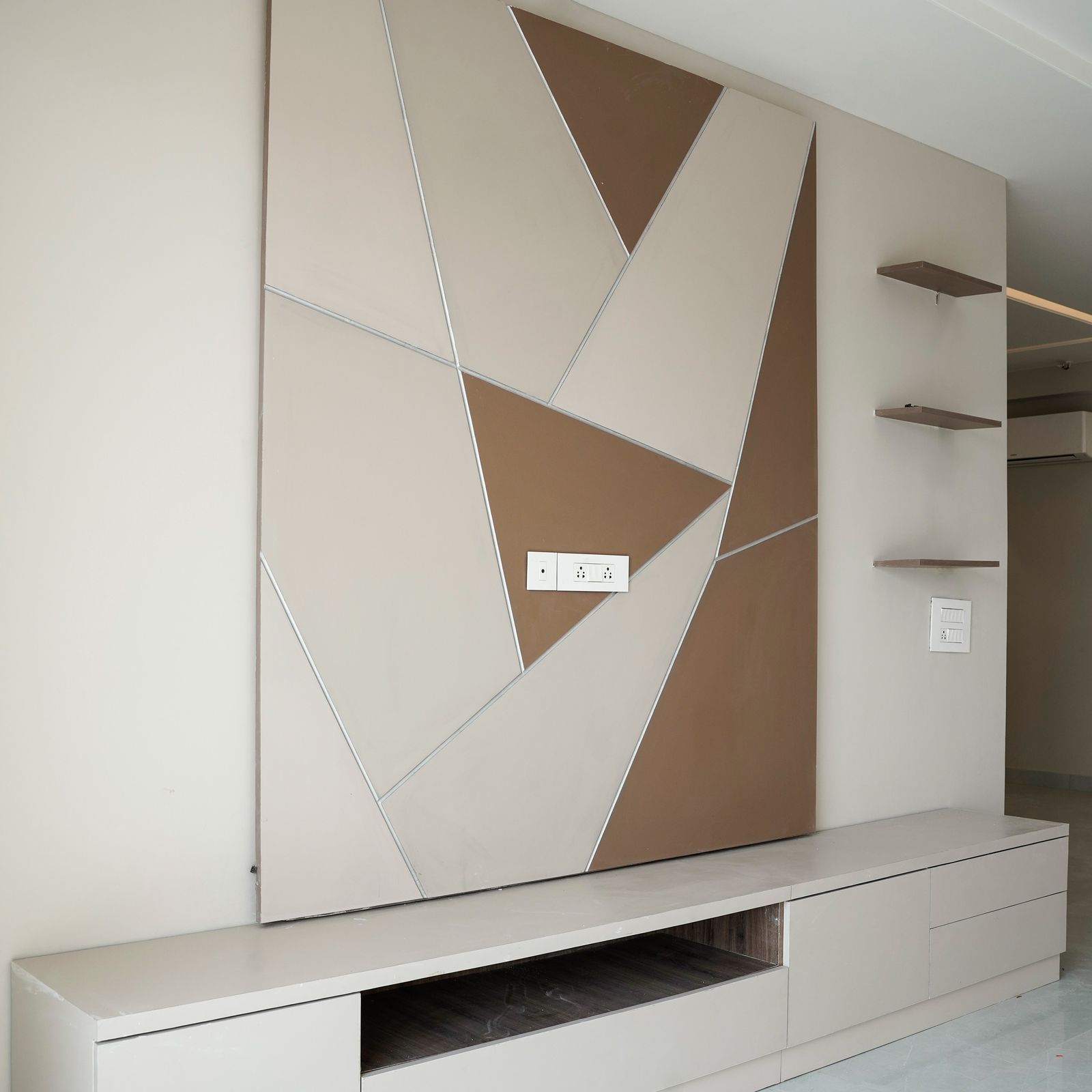 Beige and Brown TV Unit Deisgn with Geomtric Pattern Backsplash
