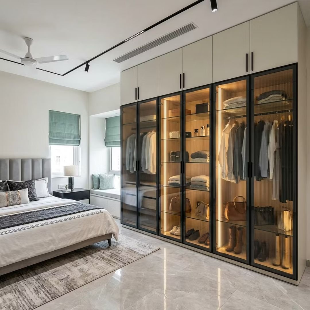 Modern White Swing Wardrobe Design with Fluted Glass Shutters and LED Lighting