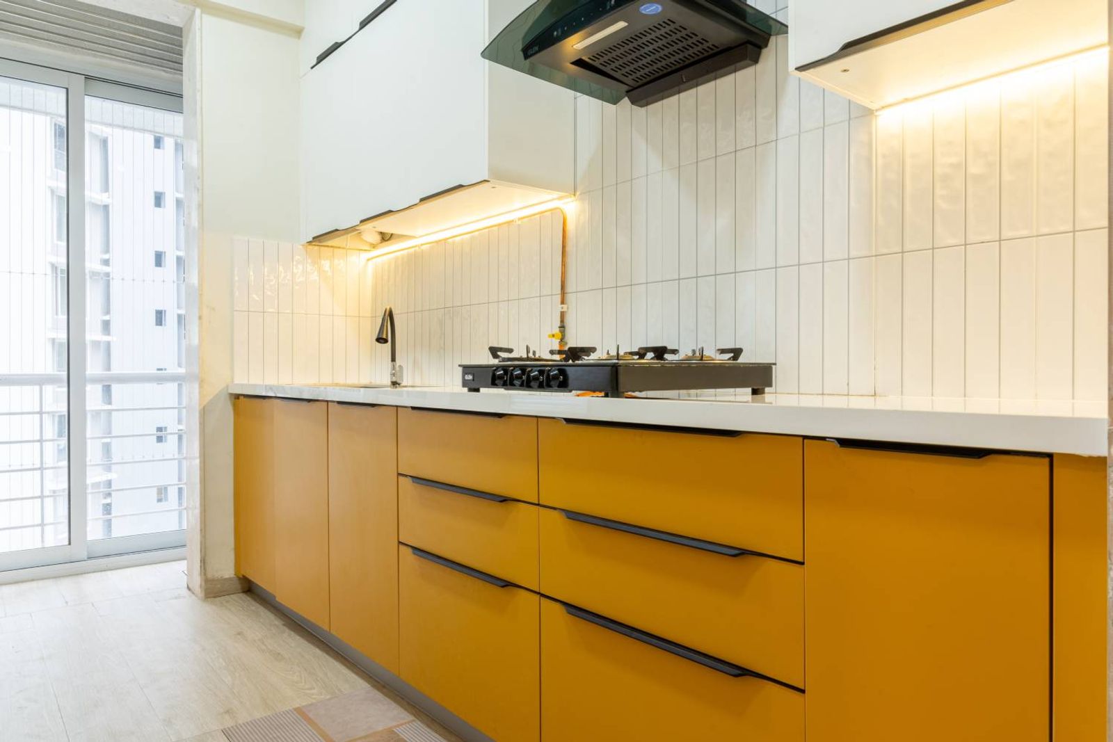Parallel Kitchen Design with Yellow and White Units and Tiled Backsplash